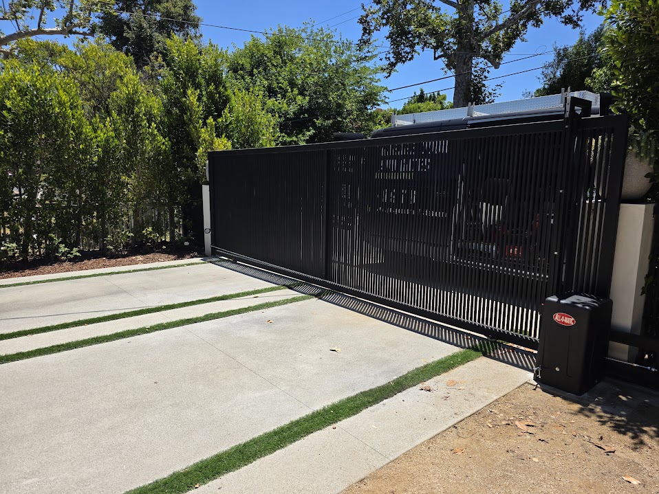 Studio City. Vertical-slat sliding gate with All-O-Matic SL100 DC gate motor.