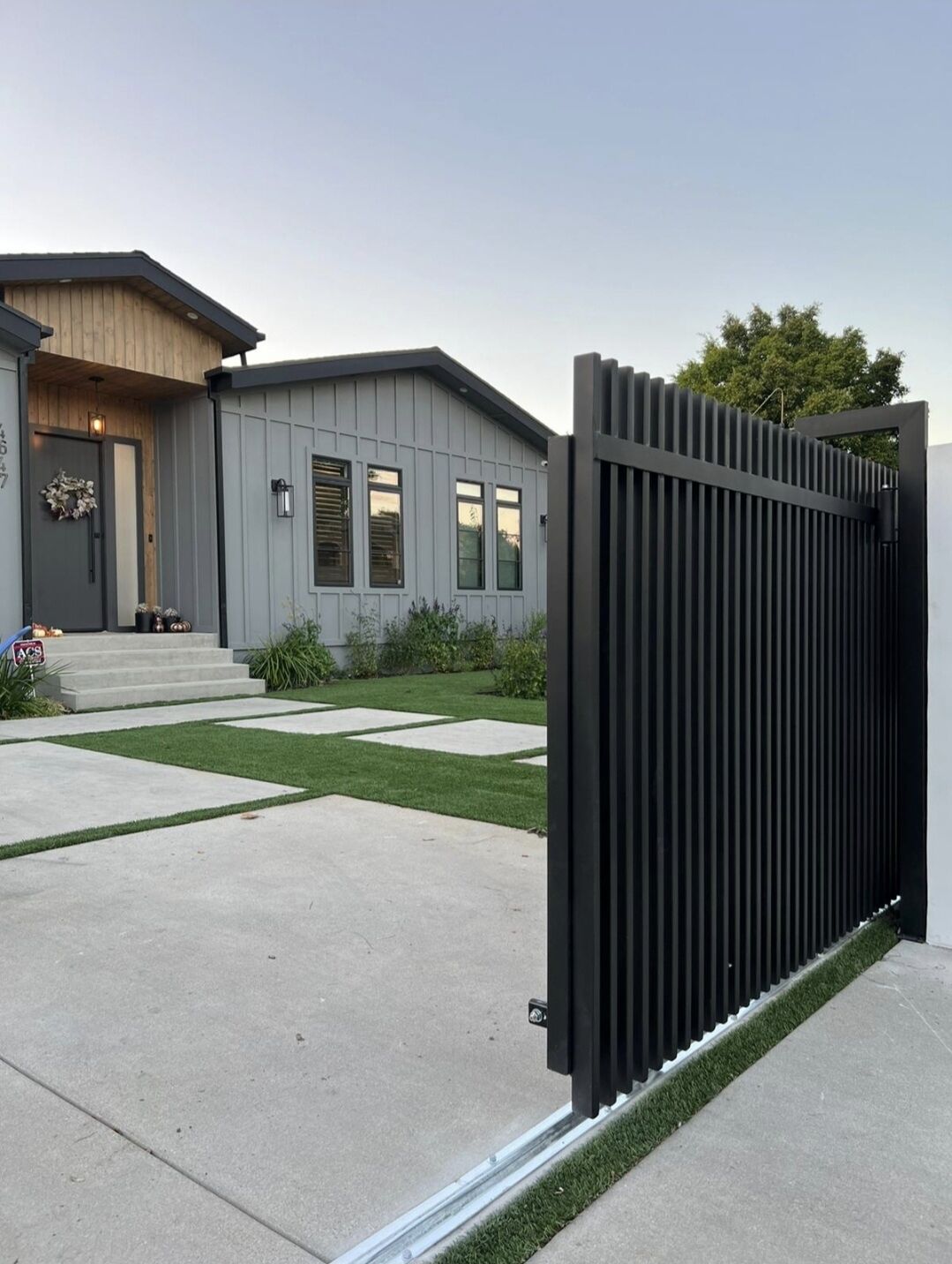 Sherman Oaks. Driveway sliding gate, columns, smooth stucco, intercom system, pedestrian gate, All-O-Matic SL90 DC gate motor.
