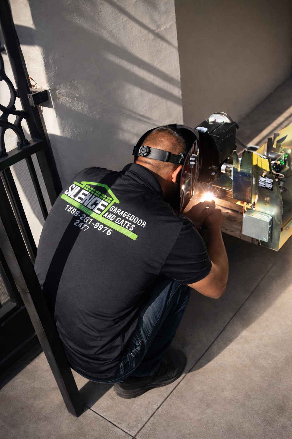 electric gate repair near me technician repairing automatic gate