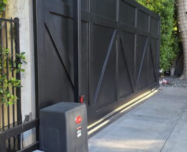 automatic gate repair los angeles technician repairing electric gate