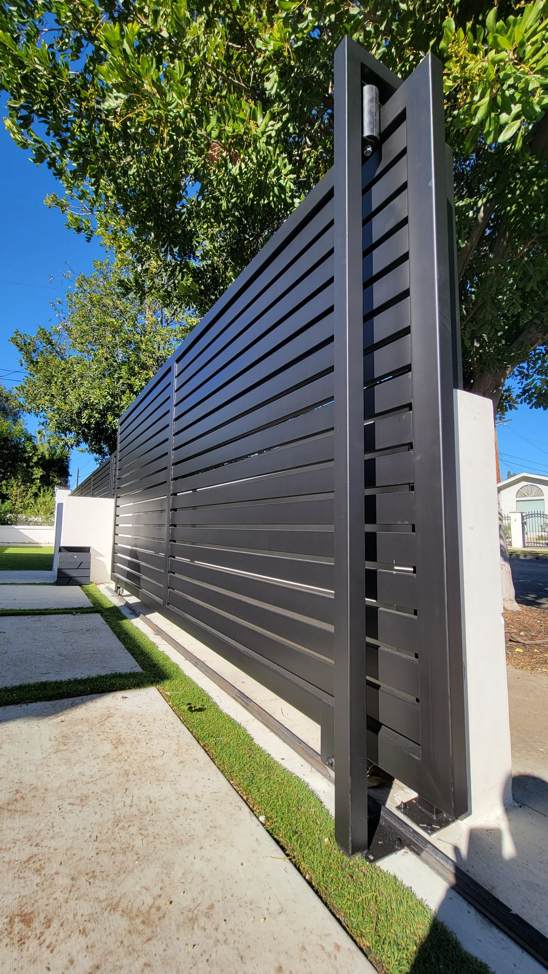 Driveway gate repaired for improved security and proper functionality