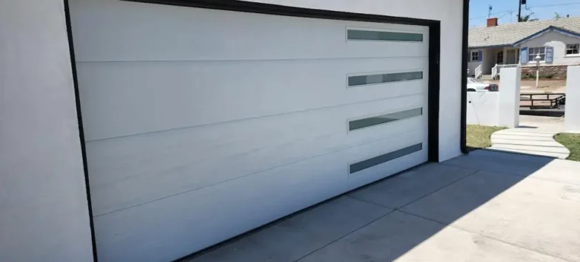 Emergency Garage Door Services repairing a residential garage door efficiently