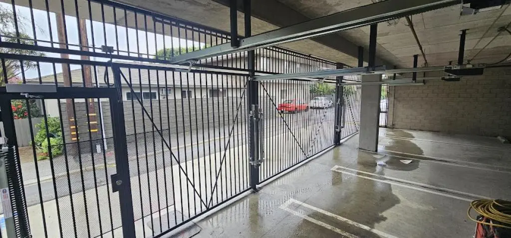 Technicians performing LiftMaster Gate Opener Repair to restore smooth gate operation