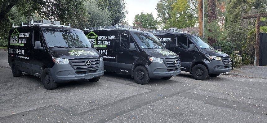 Three Silence Garage Door and Gates service vans parked together