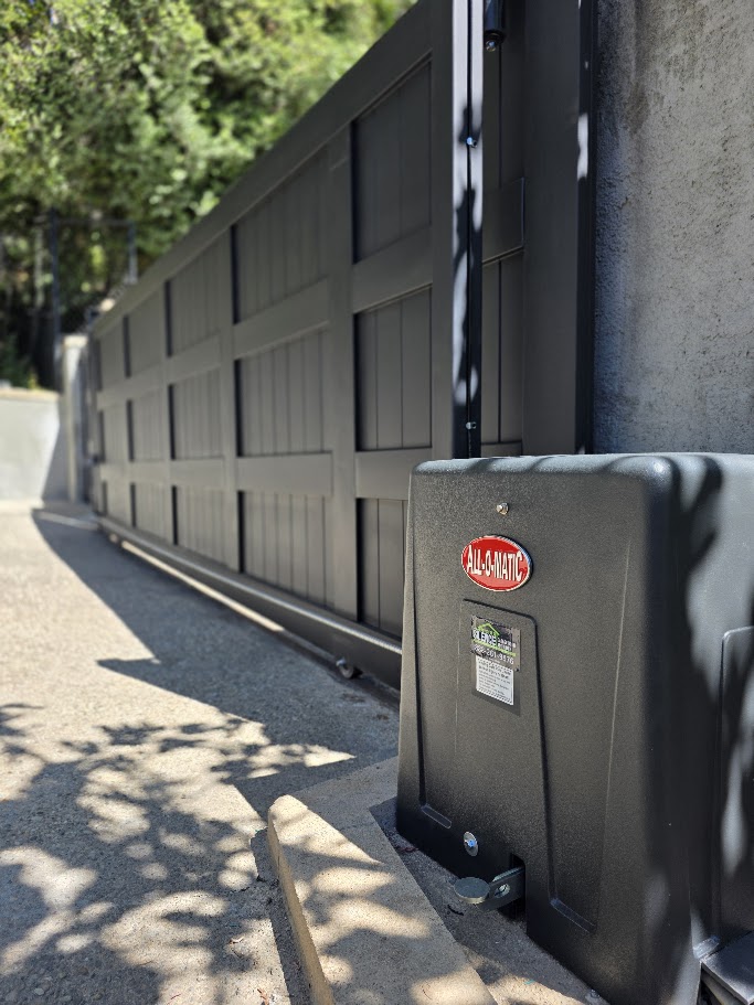 All-O-Matic gate operator installed beside a new panelled driveway gate